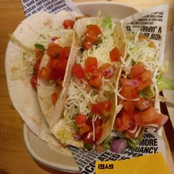 Guzman y Gomez - Close up.  2 soft tacos, one hard. Two chicken and one beef.