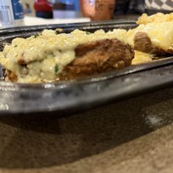 Brann's Steakhouse & Grille - Filet mignon with blue cheese crumbles on top and baked potato. Outstanding