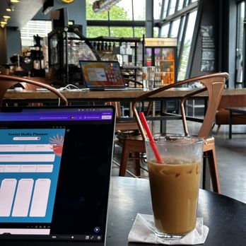 BarleyBean Coffee - a glass of iced coffee next to a laptop - Beer Bar Near Me - Austin, Texas