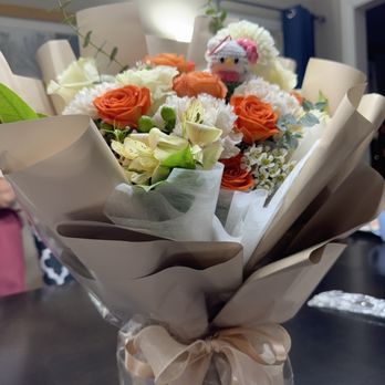 VL Floral - Bouquet with Hello Kitty keychain. Very impressive looking! Got questions from everyone at dinner asking where I bought it. - Florists Near Me VL Floral - Bouquet with Hello Kitty keychain. Very impressive looking! Got questions from everyone at dinner asking where I bought it. - Florists Near Me