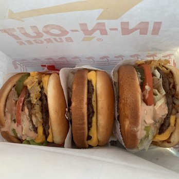 In-N-Out Burger - From the left: animal style double style, plain cheeseburger, animal style cheeseburger - Fast Food Near Me - Manteca, California In-N-Out Burger - From the left: animal style double style, plain cheeseburger, animal style cheeseburger - Fast Food Near Me - Manteca, California