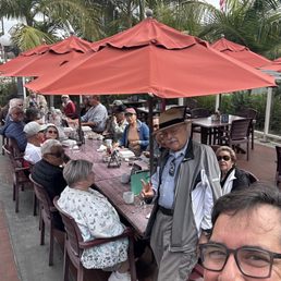 video producers and fly camera club meet for breakfast, guy with panama hat is the President of the group