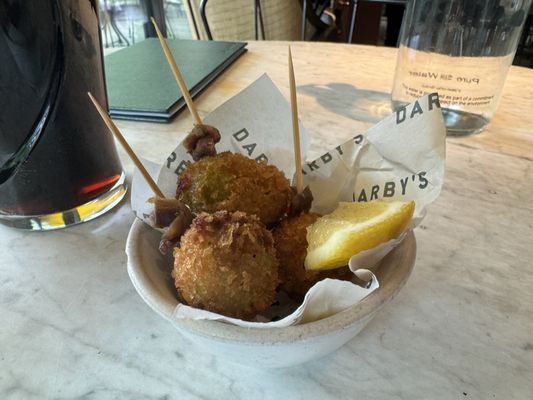 Photo of Darby's - London, XGL, GB. Deep fried olives stuffed with pork and anchovies