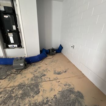 DriRite - Before cleanup, heavy clay sediment stuck to floor - Damage Restoration Near Me - Winter Garden, Florida