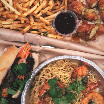 Nguyen's Kitchen - Pork bahn mi, garlic noodles with jumbo shrimp, fries, and wings | IG: @wanderfoodiiee - Vietnamese Near Me - Orange, California