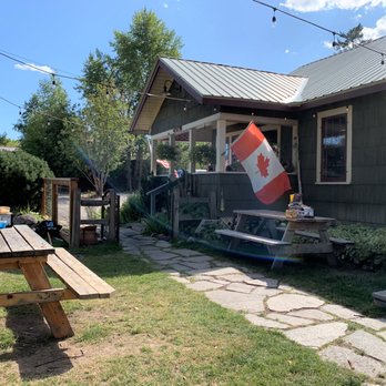 Piggyback BBQ - They do have dining tables inside the restaurant....but how can you not eat outside on a beautiful summer day! - Barbeque Near Me - Whitefish, Montana