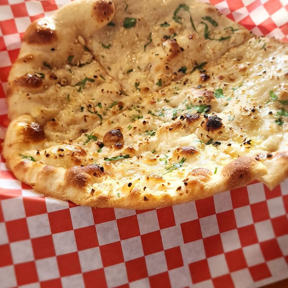 Taj Mahal - Garlic Naan. Very nice size. Tasted great - Indian Near Me - Spring Branch, Texas Taj Mahal - Garlic Naan. Very nice size. Tasted great - Indian Near Me - Spring Branch, Texas