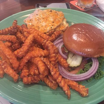 Billy Barooz - Pork loin sandwich (with buffalo sauce) and sweet potato fries - Sports Bars Near Me - Champaign, Illinois Billy Barooz - Pork loin sandwich (with buffalo sauce) and sweet potato fries - Sports Bars Near Me - Champaign, Illinois
