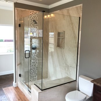 Re-Bath - a shower and toilet in a bathroom - General Contractors Near Me - Memphis, Tennessee Re-Bath - a shower and toilet in a bathroom - General Contractors Near Me - Memphis, Tennessee