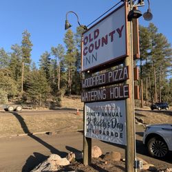 Old County Inn - Restaurant sign near road.