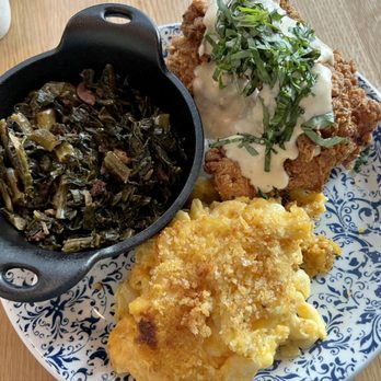 Tupelo Honey - Smothered Chicken with bacon braised collard greens and baked mac & cheese - Southern Near Me - Omaha, Nebraska Tupelo Honey - Smothered Chicken with bacon braised collard greens and baked mac & cheese - Southern Near Me - Omaha, Nebraska