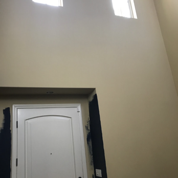Happy Hour Painting - Door wall before - we painted the blue you see to test how color would look (Not his work!) - Painters Near Me