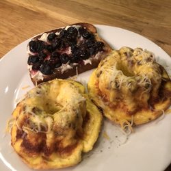 Island City Provisions - Eggy muffins with cheddar & bacon with a side of 12-grain toast, marscapone and mascerated blueberries.