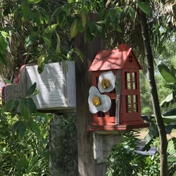 Bird feeders with the names of local businesses