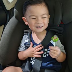 Tinted Brush Hair Salon - He's super happy with his haircut and lollipop