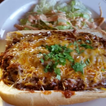 Slim's Last Chance - The texas red chili Kobe dog. My husband says finally someone knows how to make a chili dog. - Bars Near Me - Seattle, Washington