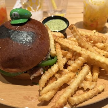 Toadstool Cafe - Luigi Chicken Sandwich / Burger with fries and extra pesto - Cafes Near Me - Universal City, California Toadstool Cafe - Luigi Chicken Sandwich / Burger with fries and extra pesto - Cafes Near Me - Universal City, California