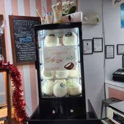 Sir Pennycandys Apothecary - Fresh young coconuts, we will punch for you and you can drink right from the coconut