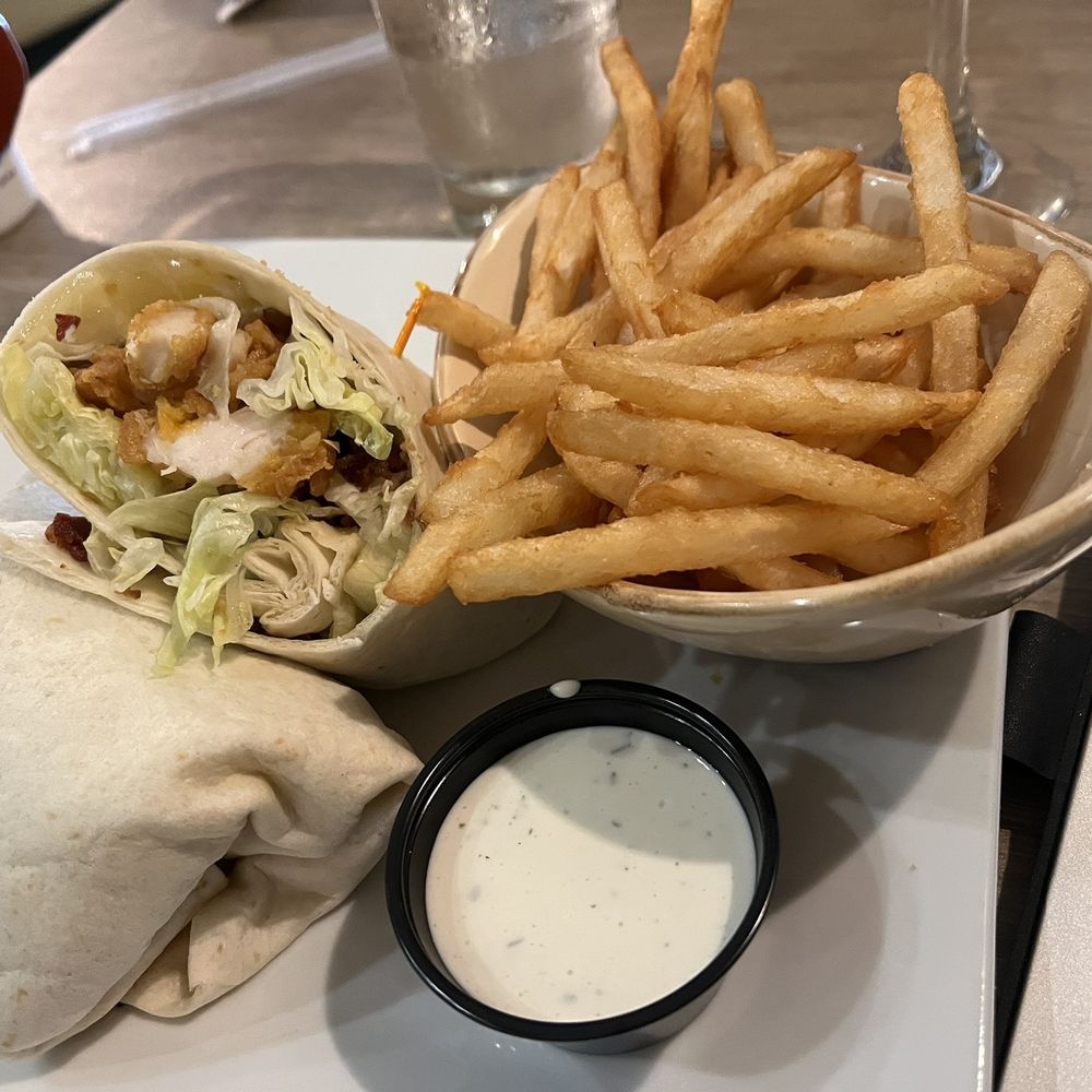 Remy’s on Main - Remy's wrap. Lettuce, more lettuce, greasy fried chicken and crumbled overcooked bacon - the fries were good - Breakfast & Brunch Near Me - Bradenton, Florida