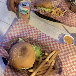 Burger St. - 2 burgers with grilled onions, bacon, Swiss and American cheese and fries