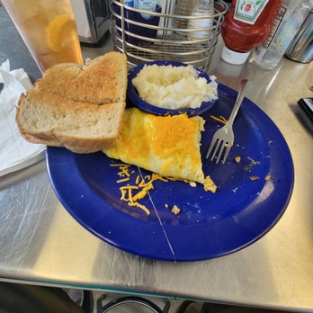 Wooden Spoon - Sausage omelet . With grits and toast - American Near Me - Marathon, Florida Wooden Spoon - Sausage omelet . With grits and toast - American Near Me - Marathon, Florida