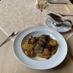 Restaurant Glocke - Venison steak medallions with potatoes and gravy. Peach wine.  out of five. About €30.