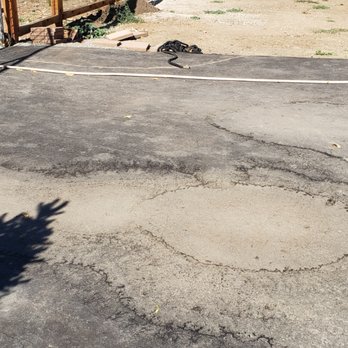 HH Asphalt Paving - Uneven sections resulting in large ugle water marks - Masonry/Concrete Near Me