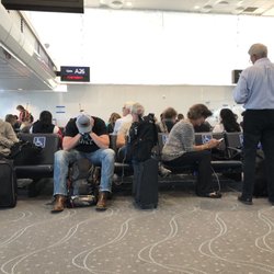 DIA Gate A29 - Maybe I'm petty, but really? This couple took four disabled seats and they do not need any.