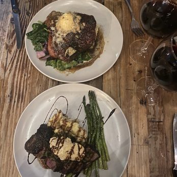 Elliot's Table - Top: pork chop. Bottom: chimichurri steak. - New American Near Me - Houston, Texas