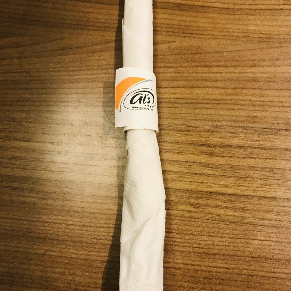 Al's Pizza - a folded napkin on a wooden table - Pizza Near Me - Jacksonville, Florida Al's Pizza - a folded napkin on a wooden table - Pizza Near Me - Jacksonville, Florida