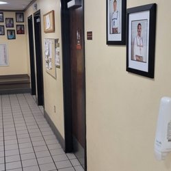 Choctaw Travel Plaza-Stringtown - Hallway bathrooms on the right some of the Choctaw Indian famous people on the wall showers on the left