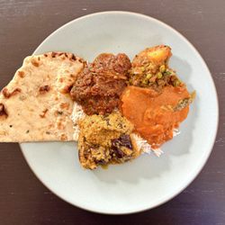 Plain Naan, Lamb Vindaloo, Aloo Gobi, Butter Chicken, Baingan Masala, Basmati Rice (my plated takeout order)