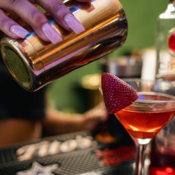 GVO Lounge & Bistro - a person pouring a drink - Hookah Bars Near Me - Dallas, Texas GVO Lounge & Bistro - a person pouring a drink - Hookah Bars Near Me - Dallas, Texas
