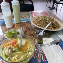 Chicken soup with chicken fried rice.