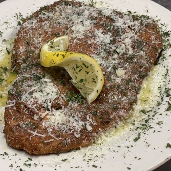 Grande Pizza - a piece of meat with parmesan cheese and a lemon wedge - Pizza Near Me - Gibsonia, Pennsylvania Grande Pizza - a piece of meat with parmesan cheese and a lemon wedge - Pizza Near Me - Gibsonia, Pennsylvania