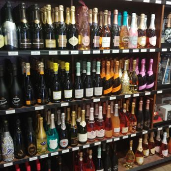 The Buzz - a shelf full of wine bottles - Beer, Wine & Spirits Near Me - New York, New York The Buzz - a shelf full of wine bottles - Beer, Wine & Spirits Near Me - New York, New York