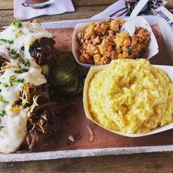 Barbosa's Barbeque & Catering - Pulled pork biscuits and gravy with homemade grits and Mexican corn salad