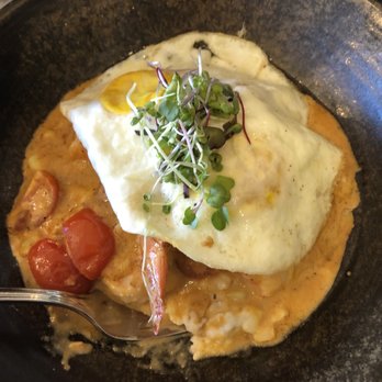 La Belle Vie Kitchen - Shrimp and Grits. Added sunny side eggs on it. - French Near Me - Suwanee, Georgia La Belle Vie Kitchen - Shrimp and Grits. Added sunny side eggs on it. - French Near Me - Suwanee, Georgia