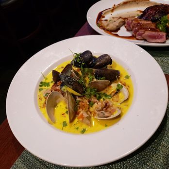 Fin Seafood - Seafood paella and the duck duo in the back - Seafood Near Me - Newport News, Virginia
