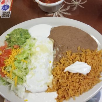 Mazatlan Restaurant - Chicken enchilada with rice and refried beans. - Mexican Near Me - Ruddell, Texas Mazatlan Restaurant - Chicken enchilada with rice and refried beans. - Mexican Near Me - Ruddell, Texas