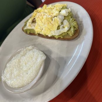 The Toasted Yolk Cafe - Avocado Toast with grits - Breakfast & Brunch Near Me - Houston, Texas The Toasted Yolk Cafe - Avocado Toast with grits - Breakfast & Brunch Near Me - Houston, Texas