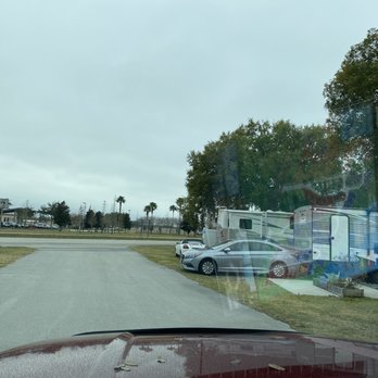 The Outpost RV Resort - The front of the property. Sites basically on the highway. That's the airport in the background. - RV Parks Near Me - Winter Haven, Florida The Outpost RV Resort - The front of the property. Sites basically on the highway. That's the airport in the background. - RV Parks Near Me - Winter Haven, Florida