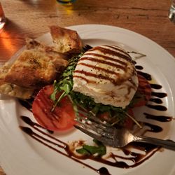 Isola - Mozzarella with greens tomato,and really good flavored bread all with a glaze. Really nice.