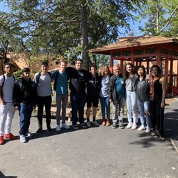 Sequoia High School - A group of Sequoia students taking pictures at the end of the tour with Curtis Roberts and the documentary camera crew.