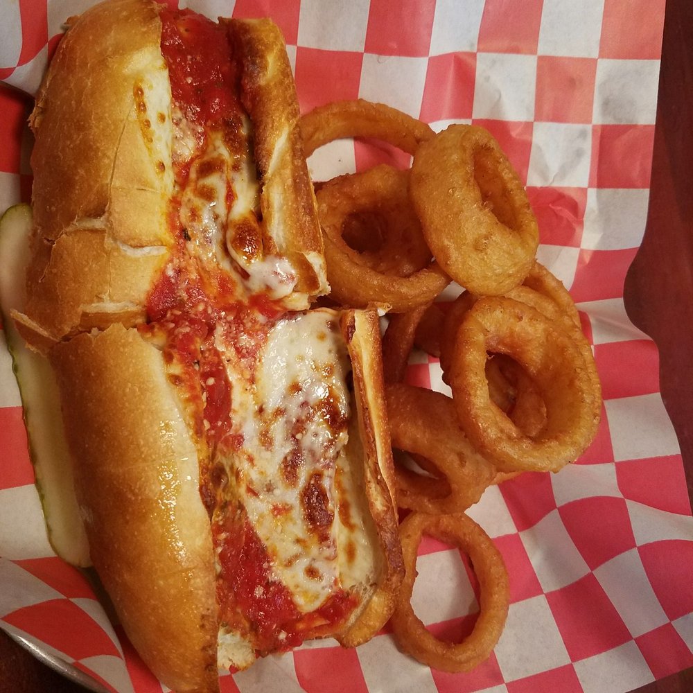 Vinny's King George Pizzaria - Eggplant Sub with onion rings - Pizza Near Me - King George, Virginia Vinny's King George Pizzaria - Eggplant Sub with onion rings - Pizza Near Me - King George, Virginia