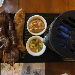 Chicken and beef skewers, that you heat over an open flame that is provided