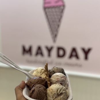 Mayday Ice Cream - a hand holding a container of ice cream - Ice Cream & Frozen Yogurt Near Me - Jacksonville Beach, Florida Mayday Ice Cream - a hand holding a container of ice cream - Ice Cream & Frozen Yogurt Near Me - Jacksonville Beach, Florida