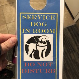 I was there turning in a guide dog puppy to the guide dog school (Southeastern Guide Dogs), so they gave me this sign to hang on my door!