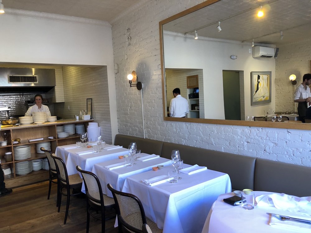 Dining area with view of open kitchen Yelp