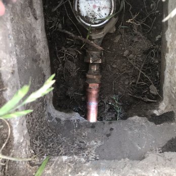 Alfredo's Landscape and Gardening Services - a water meter in a hole - Gardeners Near Me - Riverside Ca